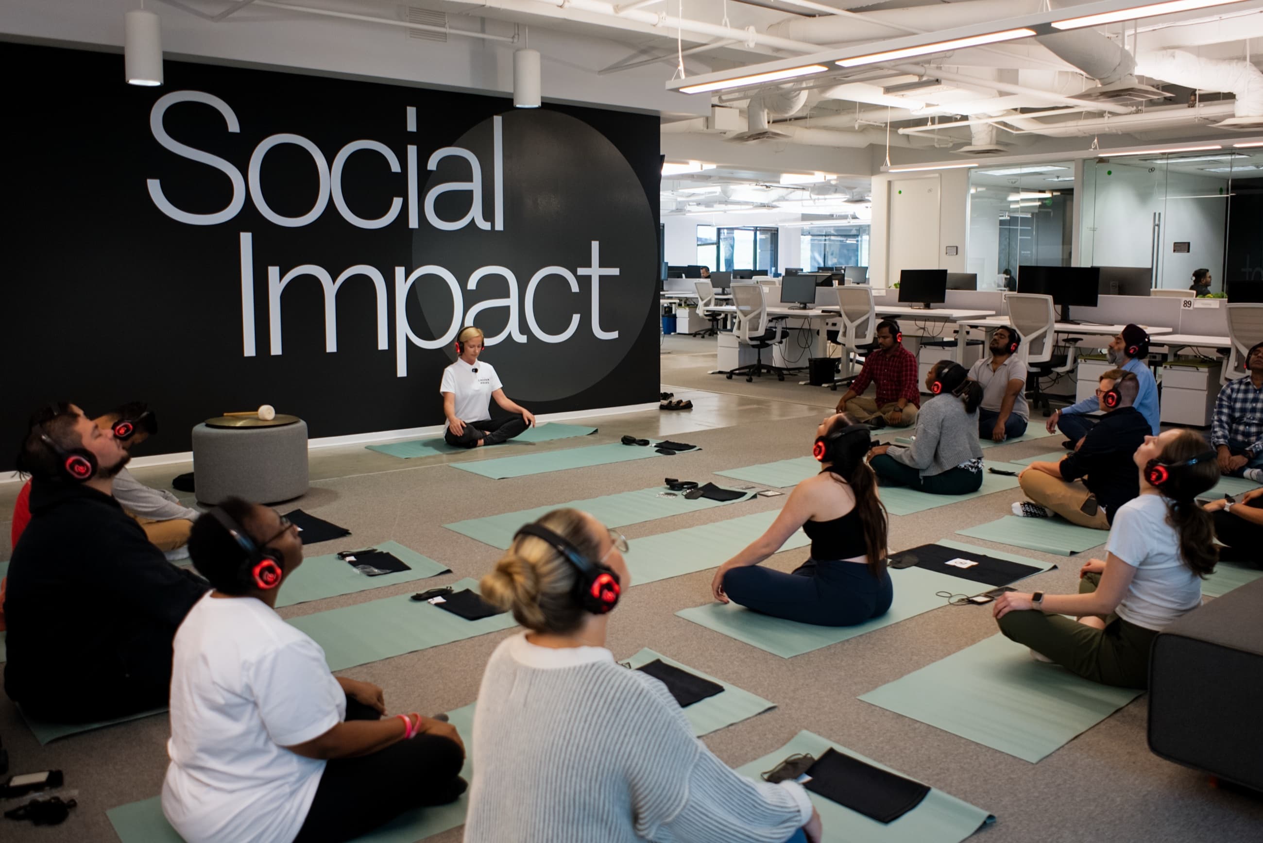 Team in a live guided headphone meditation during a midweek office reset - wellness wednesday ideas for work - Chakra Hours